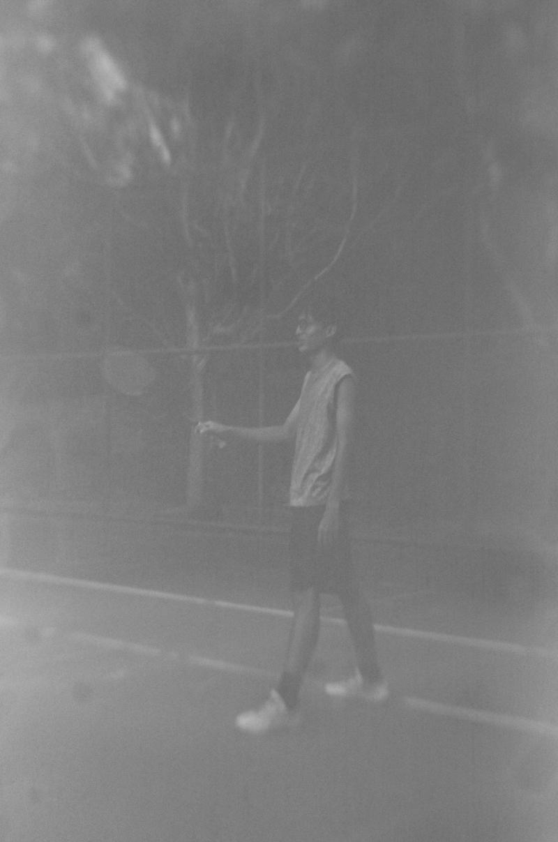 faded greyscale portrait of a badminton player
