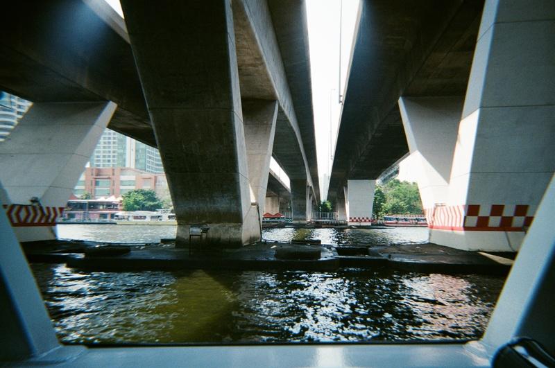 the underside of three bridges over a river